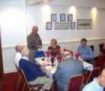 Pres.Lew presents the winners cup to Steve & Lynne